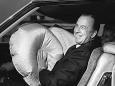 GM president Ed Cole shows off the new 1974 Oldsmobile Toronado air cushion restraint system